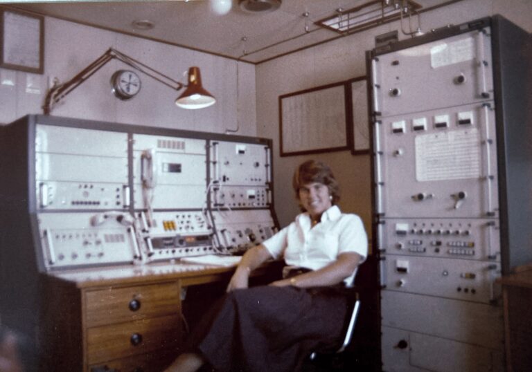 Photo courtesy of Anne Silvera, seated at a radio station.